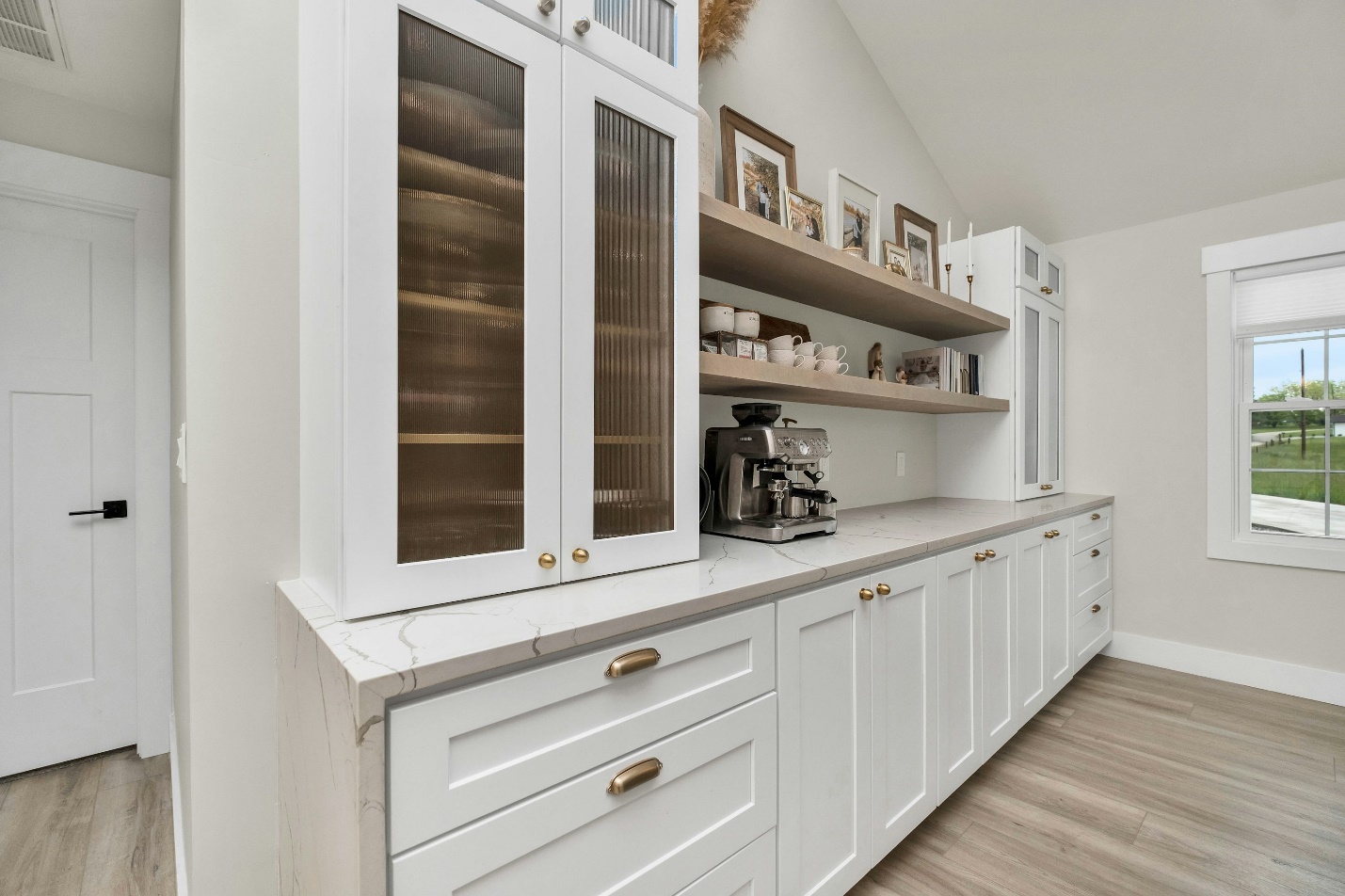 An image of a kitchen with white cabinets.