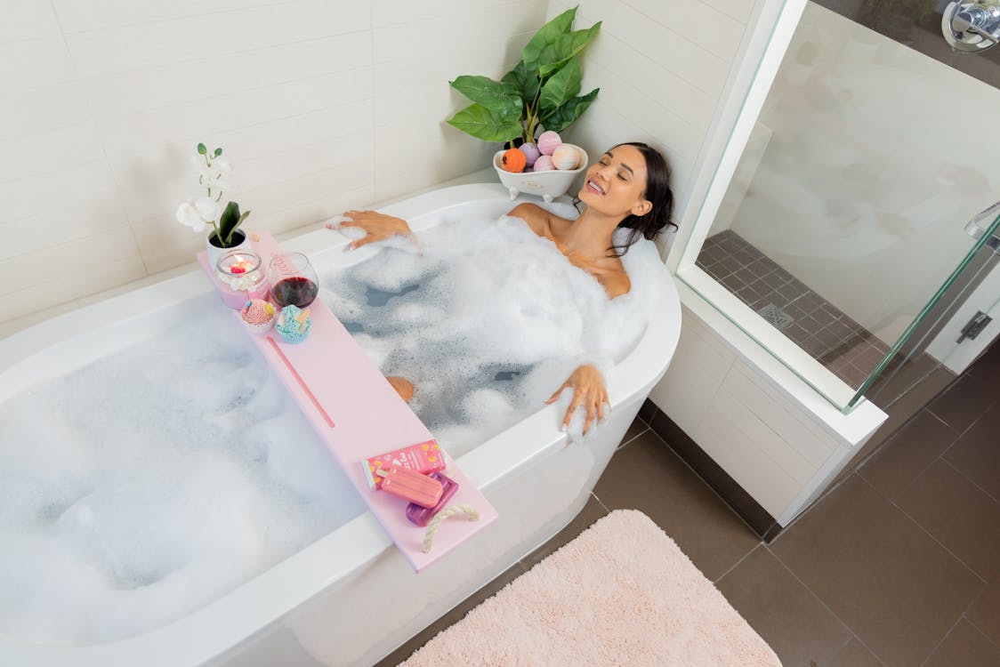 A woman soaking in a bathtub